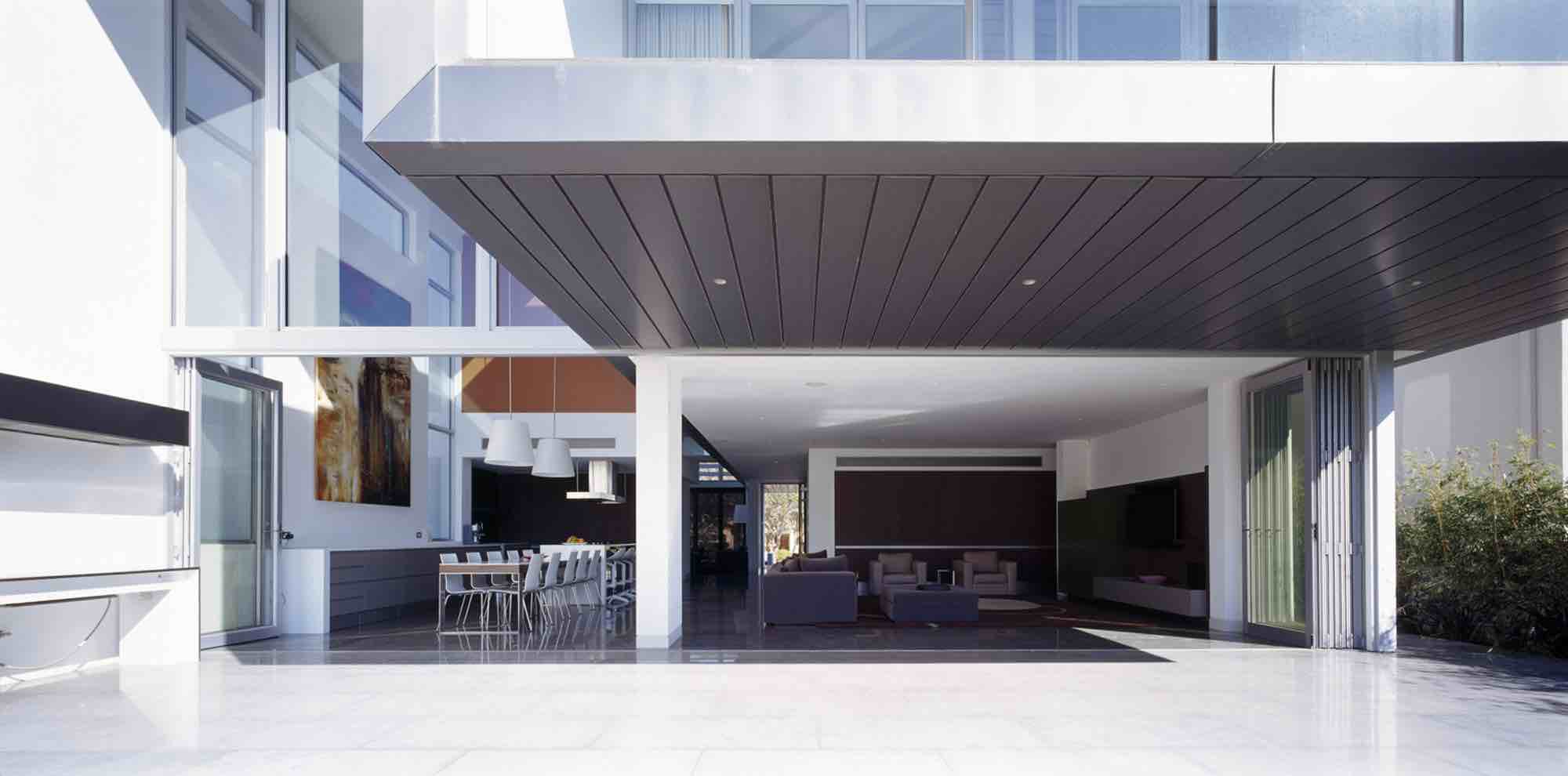 minosa-design-open-plan-high-ceiling-void-large-dinning-table-corian-benchtop-minosa-kitchen-gilda-cantilever-03
