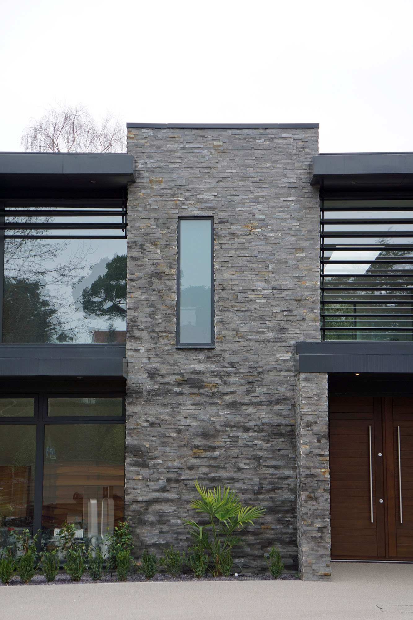 metal, glass and stone exterior 