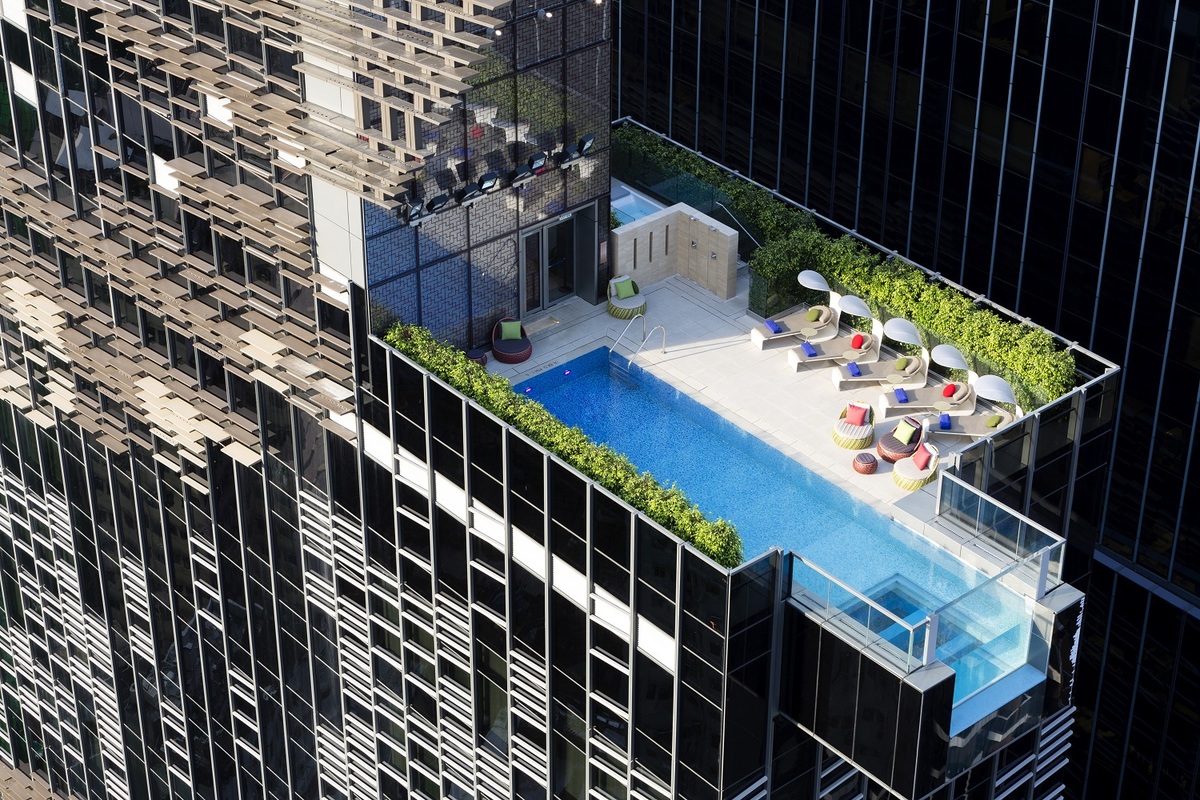 Aedas designed the Hotel Indigo in Hong Kong with a swimming pool that hangs out over the edge of the building-05