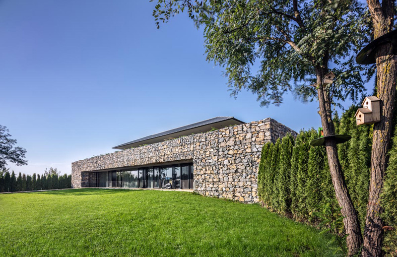 Walls made of gabion and awesome 360 degree views of Observation house by I O architects-03
