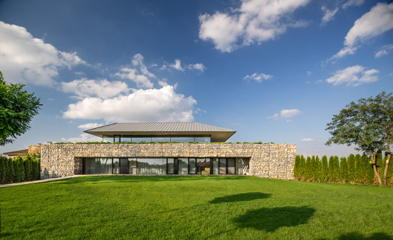 Walls made of gabion and awesome 360 degree views of Observation house by I O architects-05