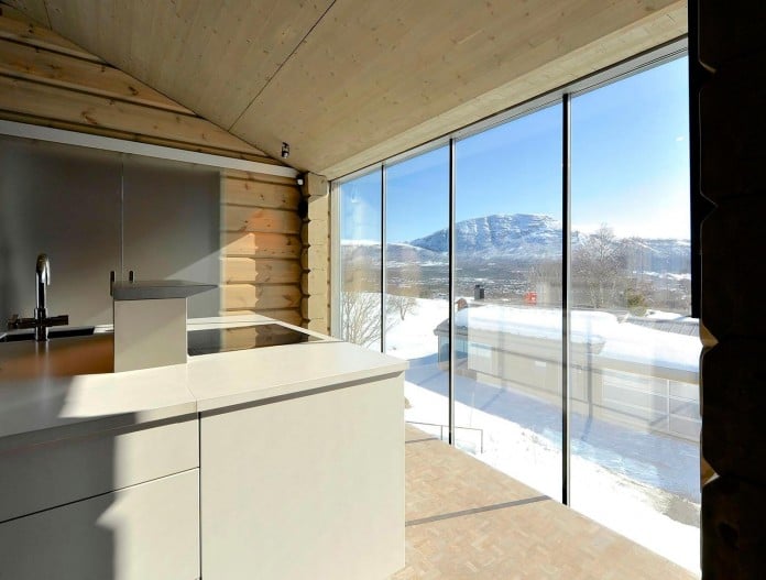 wooden-log-house-in-snowy-oppdal-norway-by-jva-12