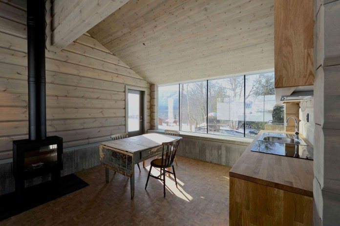 wooden-log-house-in-snowy-oppdal-norway-by-jva-13