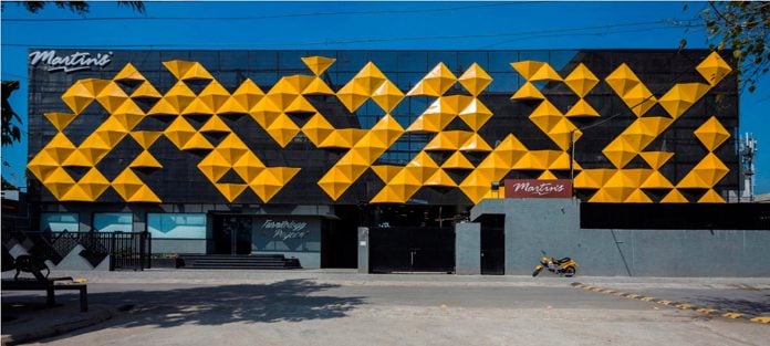 martins-dazzling-yellow-panels-facade-furniture-factory-designed-studio-ardete-01