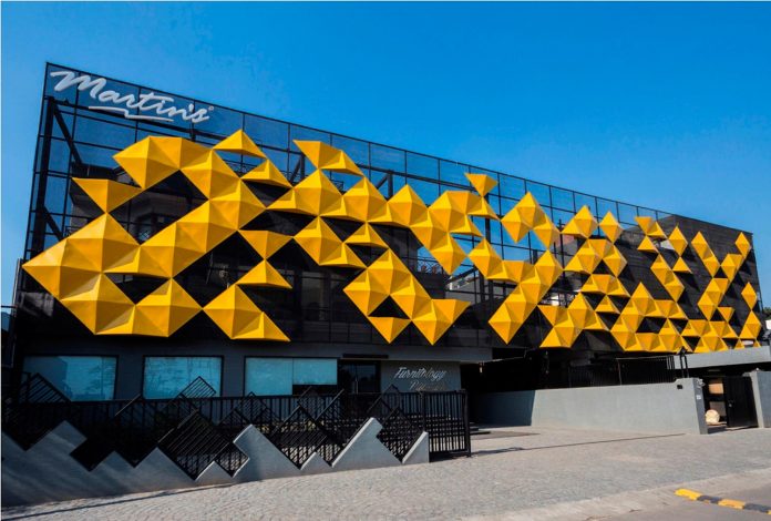 martins-dazzling-yellow-panels-facade-furniture-factory-designed-studio-ardete-04
