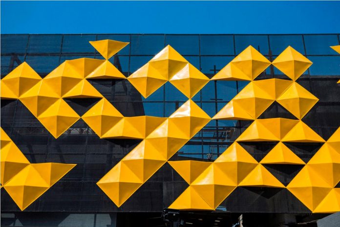martins-dazzling-yellow-panels-facade-furniture-factory-designed-studio-ardete-05