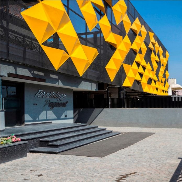 martins-dazzling-yellow-panels-facade-furniture-factory-designed-studio-ardete-09