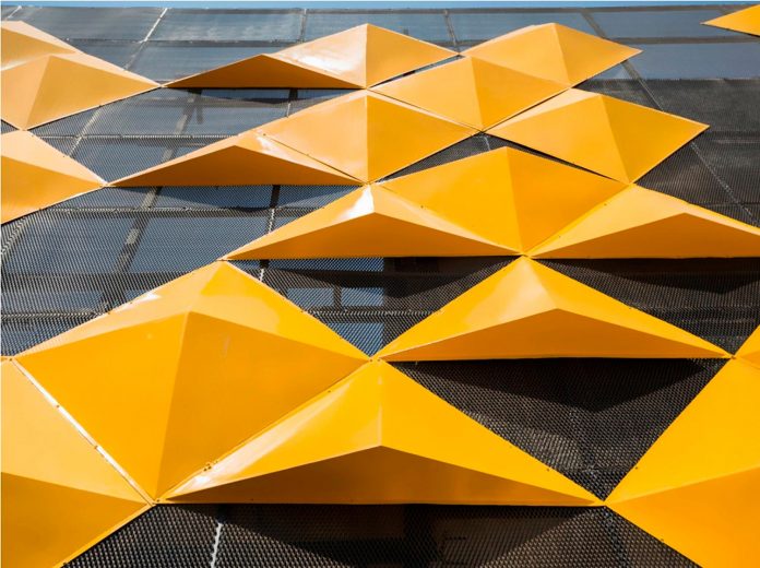 martins-dazzling-yellow-panels-facade-furniture-factory-designed-studio-ardete-12