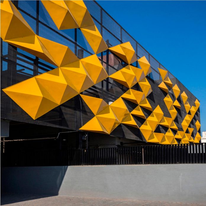 martins-dazzling-yellow-panels-facade-furniture-factory-designed-studio-ardete-13