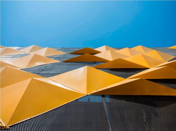 martins-dazzling-yellow-panels-facade-furniture-factory-designed-studio-ardete-15