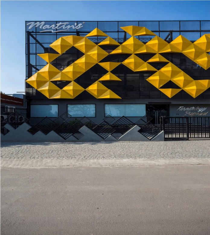 martins-dazzling-yellow-panels-facade-furniture-factory-designed-studio-ardete-21