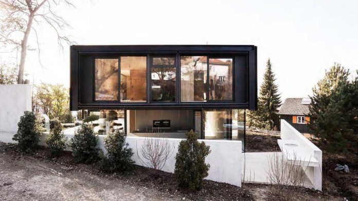 modern-house-riehen-made-glass-concrete-wood-metal-serve-designed-reuter-raeber-architects-02