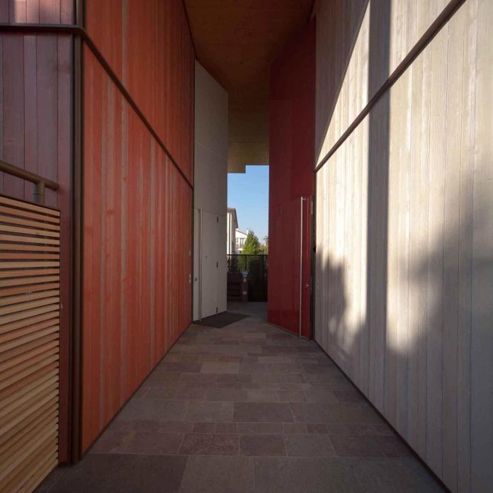 twin-house-consists-two-cubic-volumes-mounted-concrete-basement-designed-studiopietropoli-03