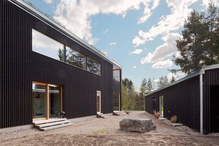wooden-building-situated-traditional-residential-area-kivistonmaki-built-architects-family-22