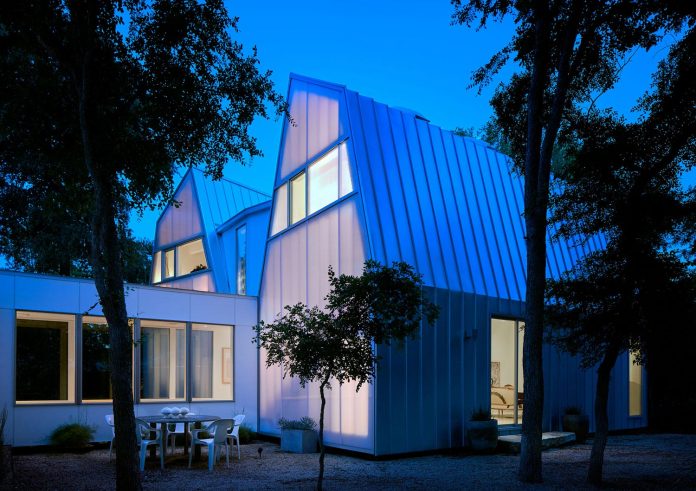 laman-residence-gruppo-architects-designed-retired-couple-set-dense-canopy-live-oak-cedar-elm-trees-25
