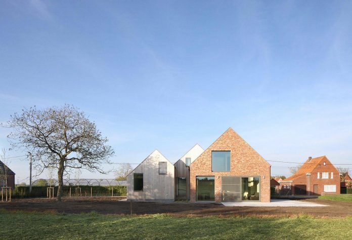 former-farmhouse-conversion-contemporary-pitched-roof-house-two-chimney-shaped-skylights-02