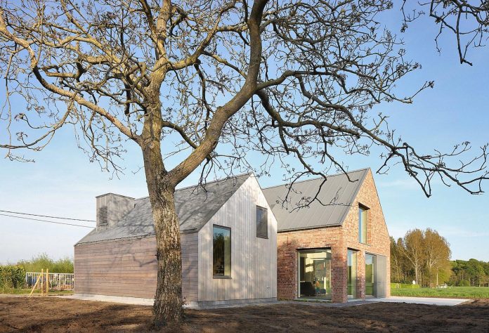 former-farmhouse-conversion-contemporary-pitched-roof-house-two-chimney-shaped-skylights-04