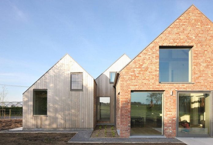 former-farmhouse-conversion-contemporary-pitched-roof-house-two-chimney-shaped-skylights-05