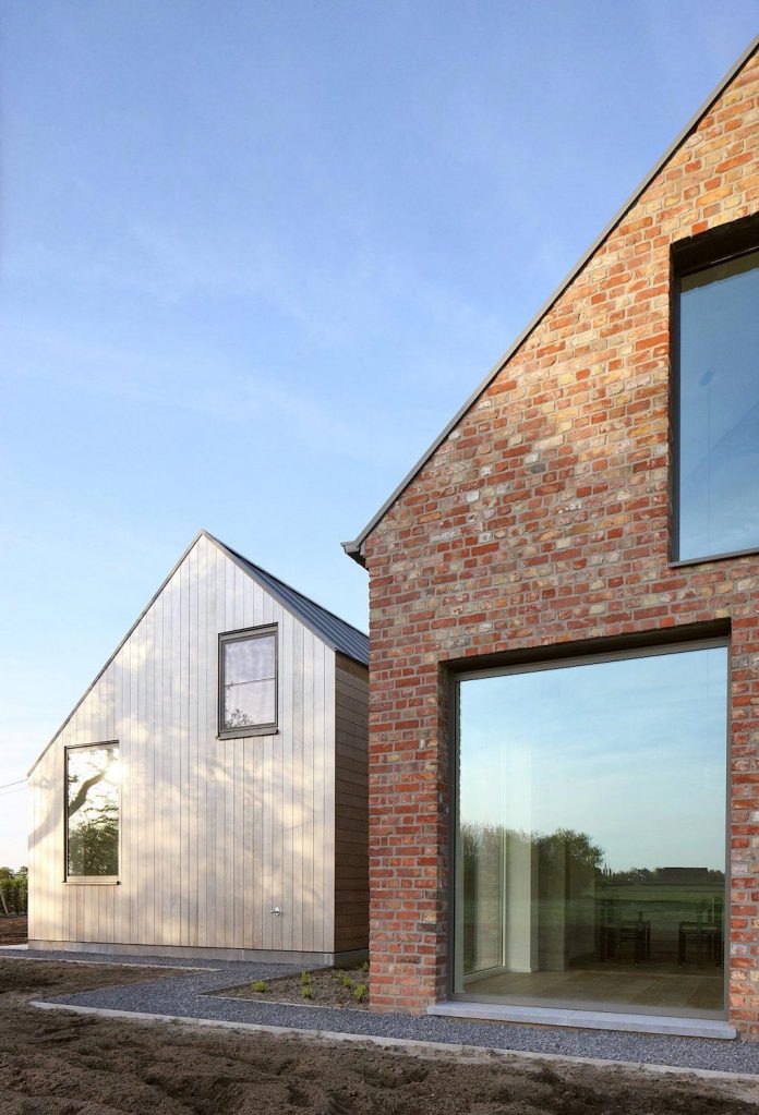 former-farmhouse-conversion-contemporary-pitched-roof-house-two-chimney-shaped-skylights-06