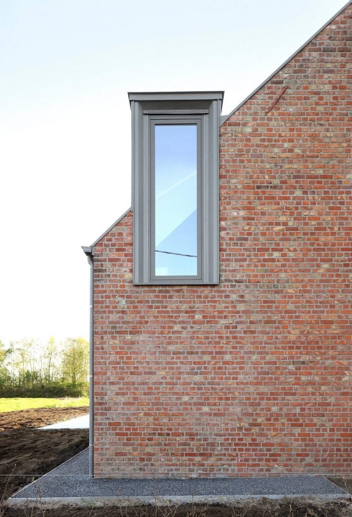 former-farmhouse-conversion-contemporary-pitched-roof-house-two-chimney-shaped-skylights-08