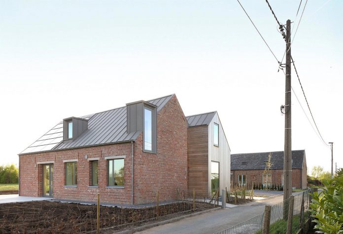 former-farmhouse-conversion-contemporary-pitched-roof-house-two-chimney-shaped-skylights-09