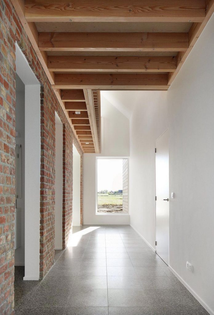 former-farmhouse-conversion-contemporary-pitched-roof-house-two-chimney-shaped-skylights-12