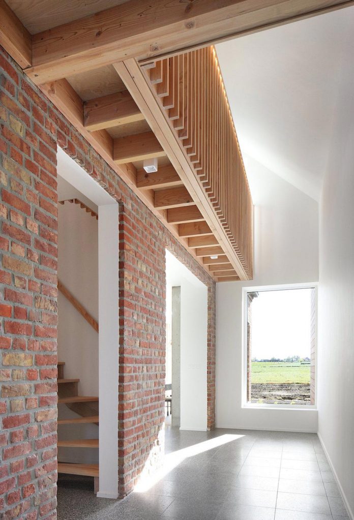 former-farmhouse-conversion-contemporary-pitched-roof-house-two-chimney-shaped-skylights-13