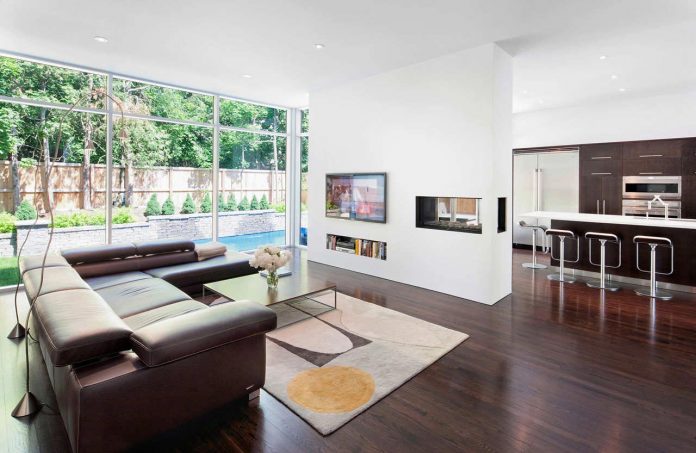 fraser-residence-minimal-palette-dark-oak-floors-cabinetry-contrast-white-surfaces-03