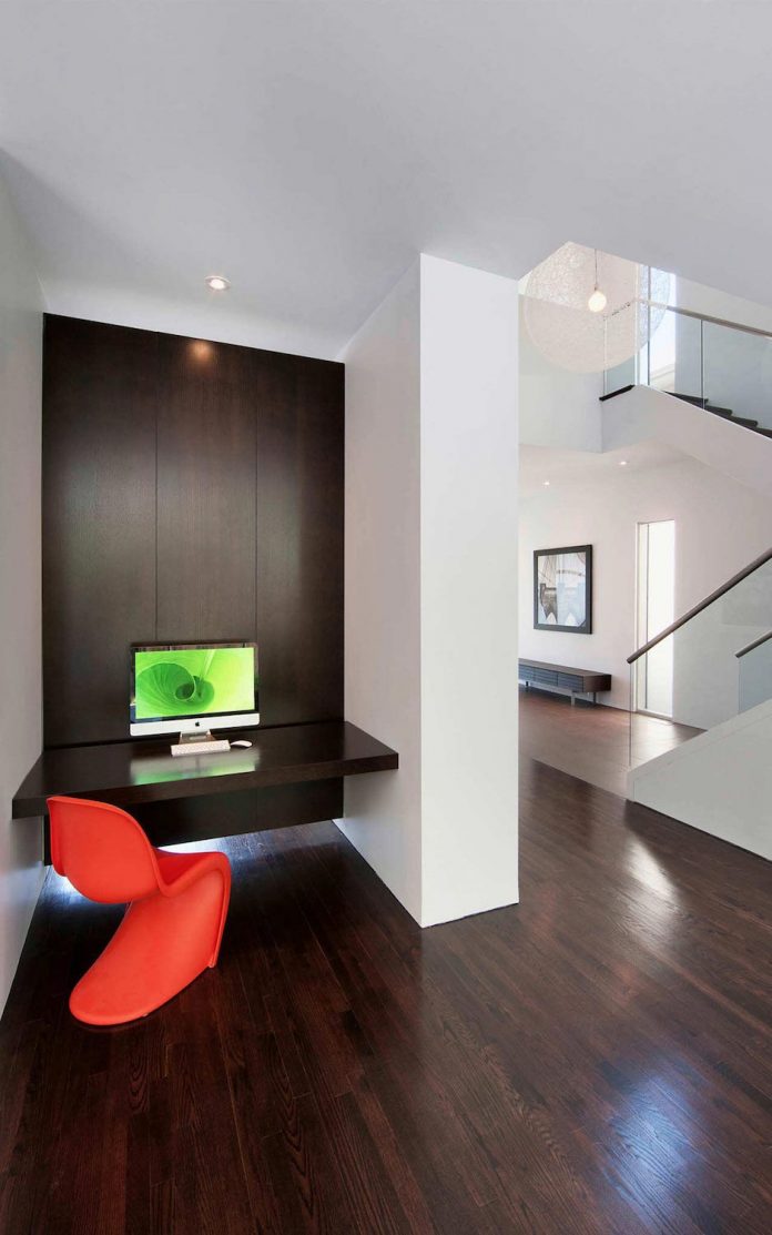 fraser-residence-minimal-palette-dark-oak-floors-cabinetry-contrast-white-surfaces-06