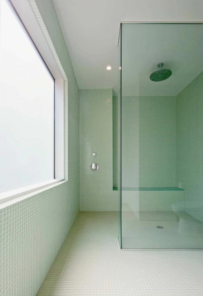 fraser-residence-minimal-palette-dark-oak-floors-cabinetry-contrast-white-surfaces-11