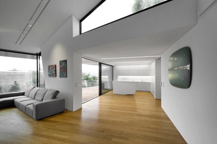 minimalist-home-design-located-south-sloping-plot-residential-part-prague-12