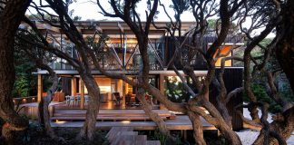 Under Pohutukawa Beach House by Herbst Architects
