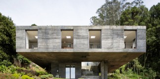 Guna House Located Between a Steeply Sloping Hillside and a Wood of Eucalyptus Trees by Pezo von Ellrichshausen