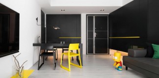 Black, white and yellow accents of H Residence by Z-AXIS DESIGN