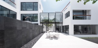 Bridged House: Two existing houses of different ages and styles as one by Ida&Billy Architects