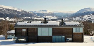 Wooden Log House in Snowy Oppdal, Norway by JVA