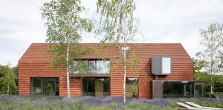Pascal François Architects design a minimalist barn type Olmen home in Balen, Belgium