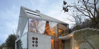 House 36 combining a stone cavern with a glass house by Matthias Bauer Associates