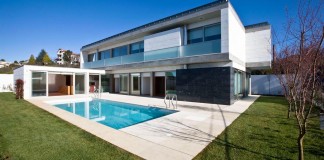 A.R. House covered in white Estremoz marble by Atelier d'Arquitectura J.A Lopes da Costa