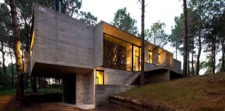 Concrete Valeria House in a lush vegetation and crossed by tall dunes designed by Luciano Kruk and María Victoria Besonías