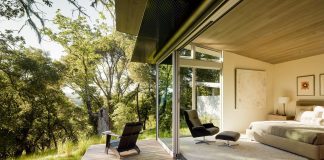 This modern take on a traditional ranch home situated Atop a ridge in the Santa Lucia mountains offers contemporary materials and landscape to a classic typology