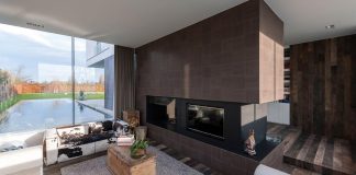 P8 Architecten design the LNT House, a contemporary two story home with indoor and outdoor pools