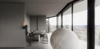 Minimalist home located high on a hillside in a residential settlement in the Province of Varese