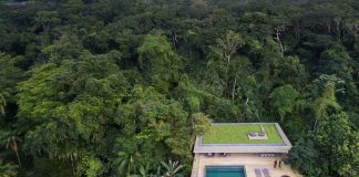 Jungle House by Studiomk27: home in a rain forest settled on a mountainous topography with dense vegetation