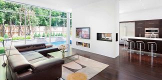 Fraser Residence: minimal palette of dark oak floors and cabinetry contrast the white surfaces