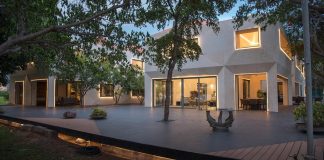 French villa approach with pyramidal hipped-roof located on a peninsula