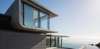 Contemporary house above a rocky cove on Waiheke Island in Auckland’s Hauraki Gulf