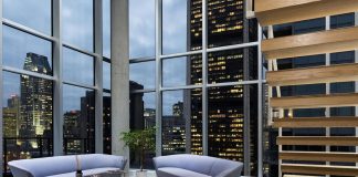 Contemporary penthouse minimally dressed, white predominant, designed for some students
