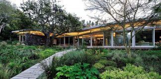 Open plan house defined by simplicity of lifestyle and ease of use on a beautiful wooded riverside site in the Constantia Valley