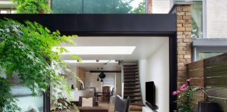 Brown brick family house contrasting modern sharp lines with vintage furniture